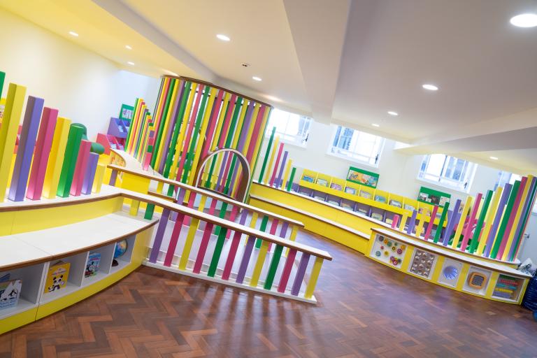 A bright and colourful interior room at Bolton Central Library.