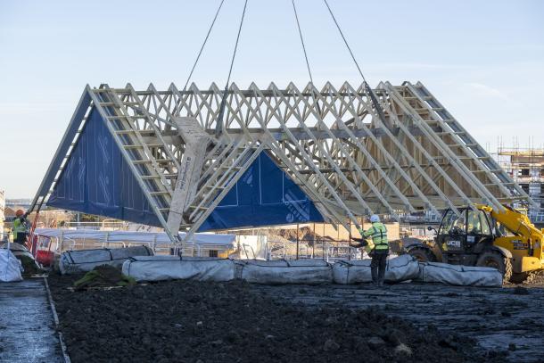 Robertson Timber Engineering roof being lifted by a crane