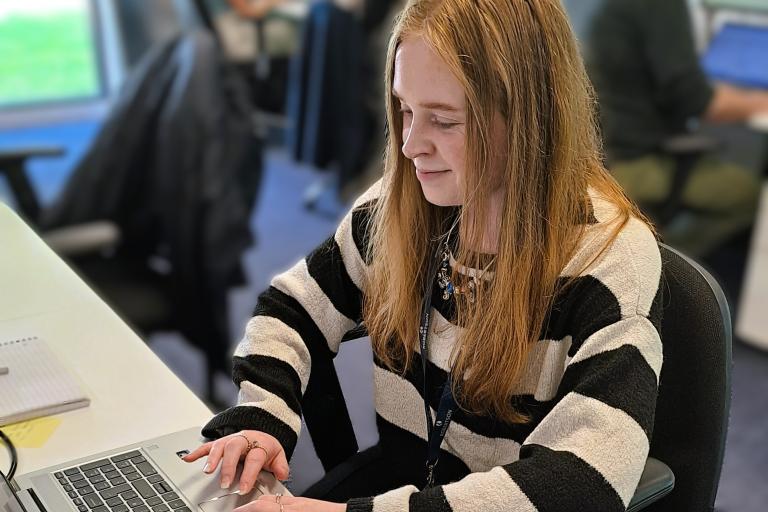 Caitlin at desk