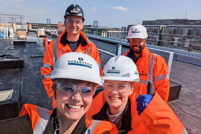 Selfie of Robertson Construction employees with Blackpool Council delegate at the Talbot Gateway project during construction