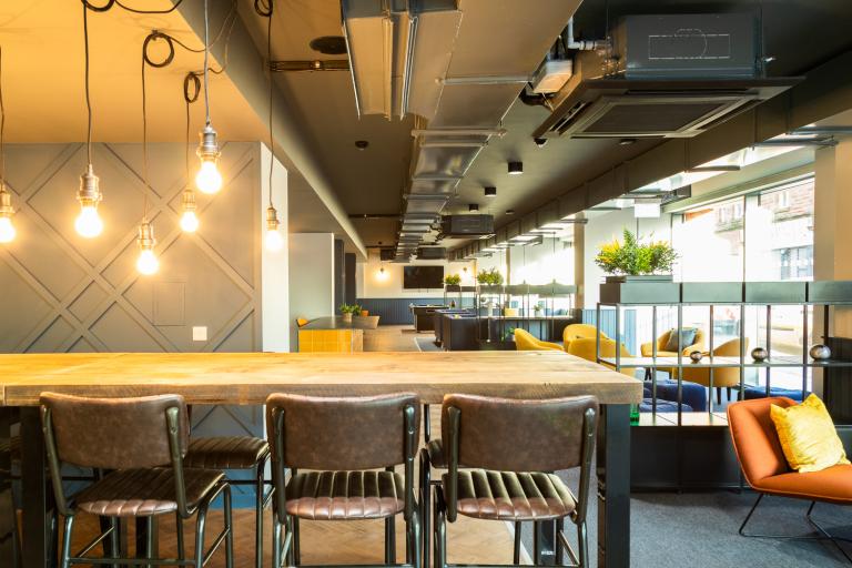 Breakfast bar seating within a communal student accommodation breakout area