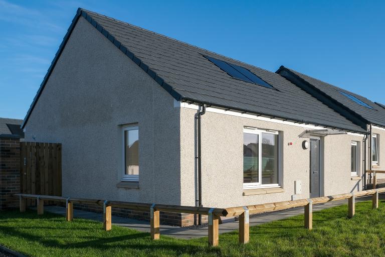 Energy-efficient bungalow with blue skies at the Pitcorthie development in Dunfermline, delivered by Robertson Construction for Fife Council