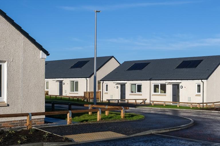 Energy-efficient bungalow with blue skies at the Pitcorthie development in Dunfermline, delivered by Robertson Construction for Fife Council