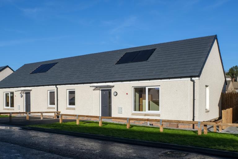 Energy-efficient bungalow with blue skies at the Pitcorthie development in Dunfermline, delivered by Robertson Construction for Fife Council